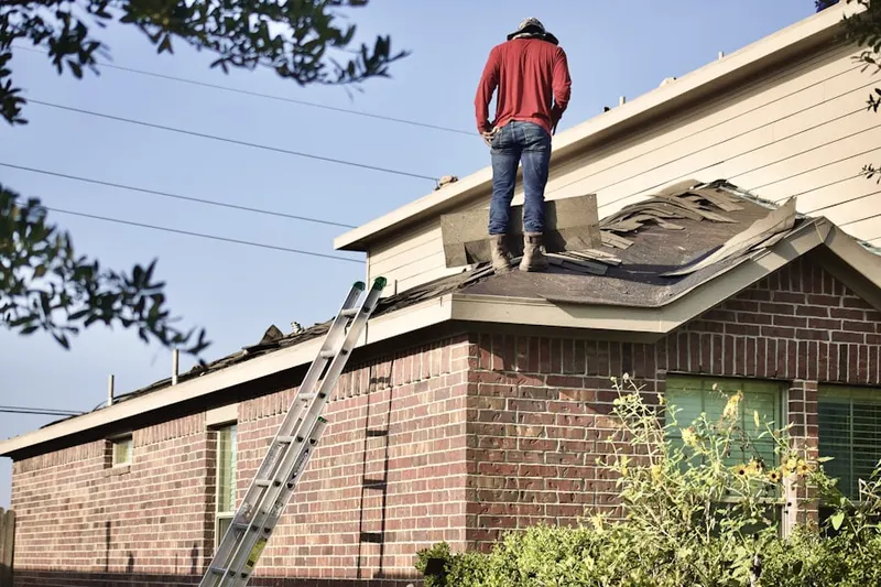 Professional roofer working on a residential roof in Ladera Heights